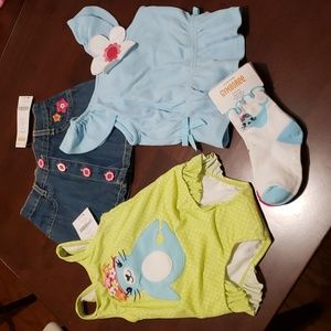 Gymboree 4 piece set size 6-12 mos. Top, denim skirt, swimwear. Socks 12-24 mos.